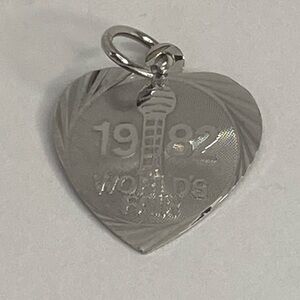 1982 WOLDS FAIR CHARM IN STERLING SILVER